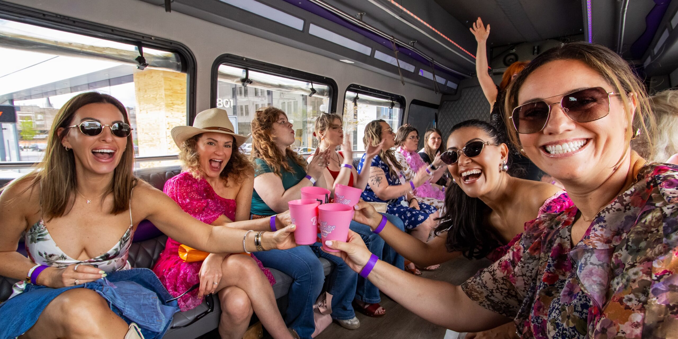 people cheers their drinks on a party bus in nashville tennessee